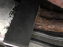 This is by the driver’s rear tire