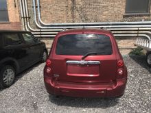 From the rear. A small dent. 