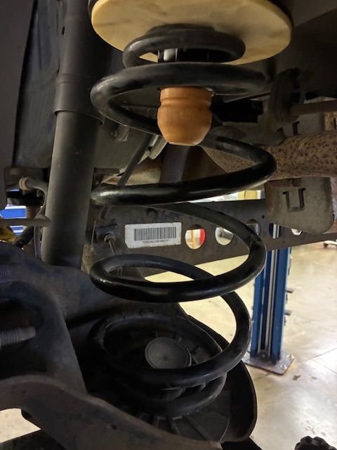 New upper jounce assembly installed - note the lower seat looks okay 12/10/25