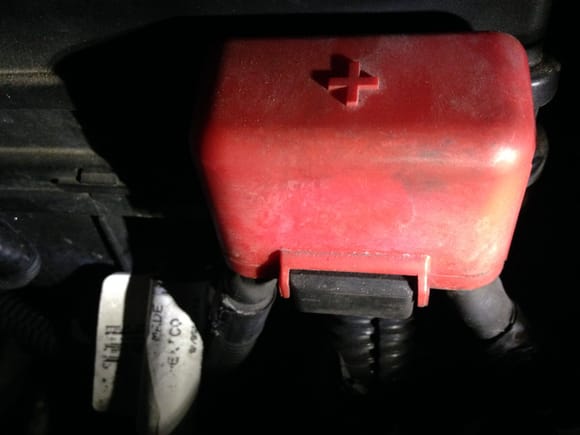 Here is the cap safety cap on the left side of the fuse block towards the front 