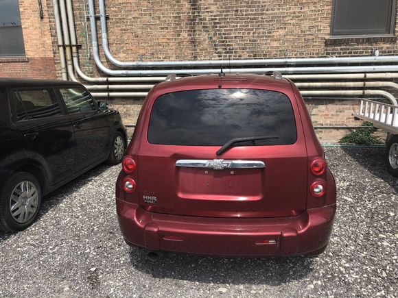 From the rear. A small dent. 