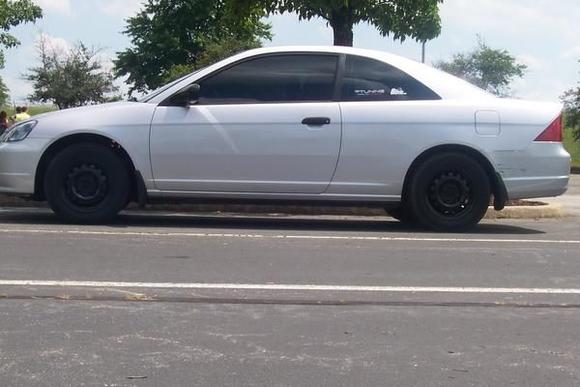 I have tinted my windows at 20% and took off my hub caps and painted my "steelies" black.  Since this picture i have lowered about 2 inches, and will be buying a set of 17" rims and tires.  More pictures coming soon