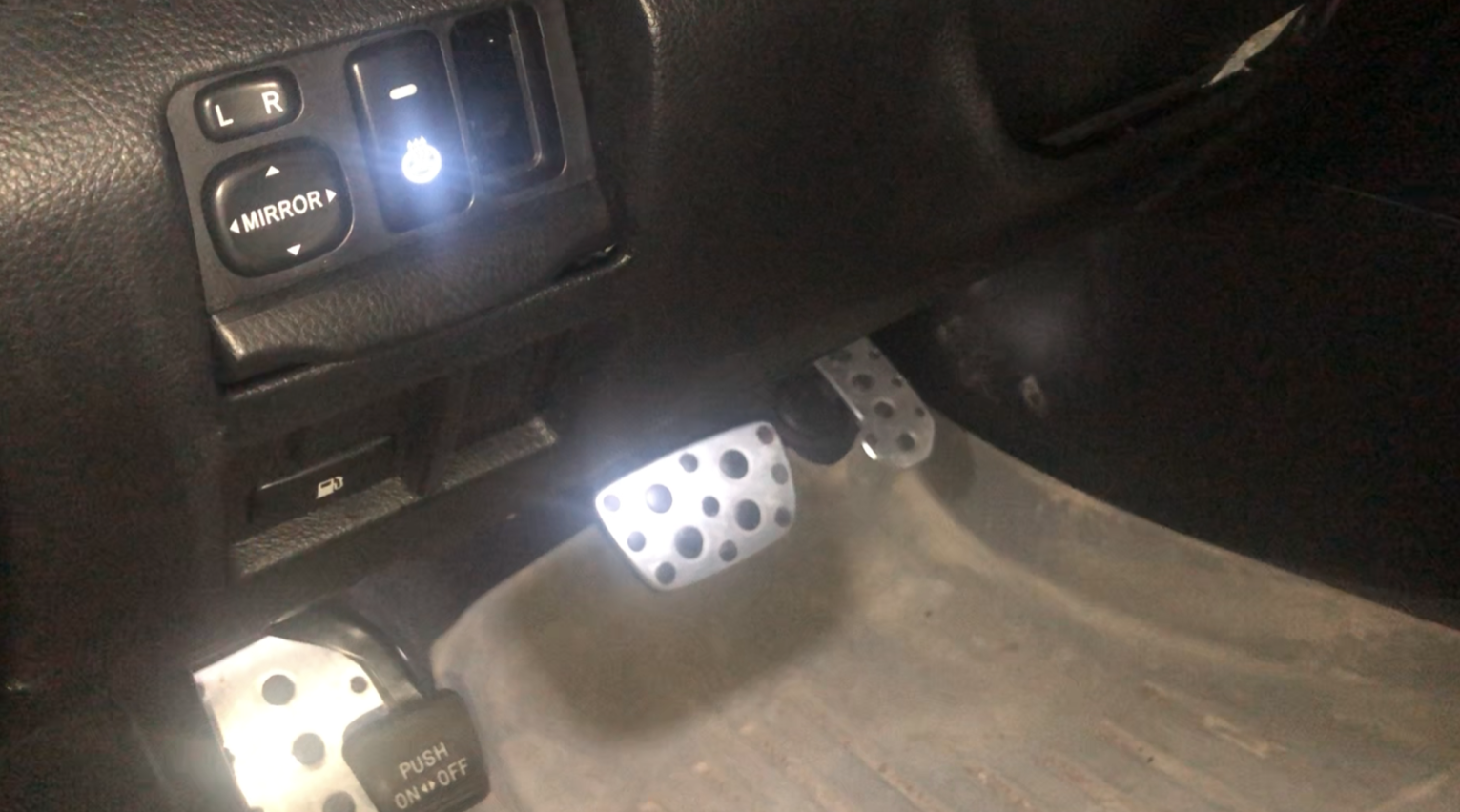 How to disable side mirror tilting down when the 2007 RX350 is put in