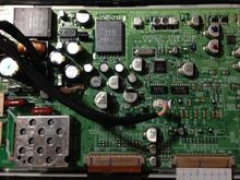 This is the LCD controller board. This is separate from the main processor board. It contains all components to drive the LCD by itself. The dangling connector is for power and control of the CCFL backlight from the main board.

If you removed this and the LCD, you would have just your average LCD monitor.