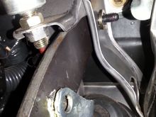 Shoulder bolt is perfect fit(top of screen).two M10 flat washers and one M10 Lock washer used  to fill the gap. One M8 lockwasher and one M8  Self-locking nut used on threaded portion to cap it off.

Look at the gap between the brake cylinder clevis(has yellow grease) and brake pedal arm

This confluence soalswad also causing noise...