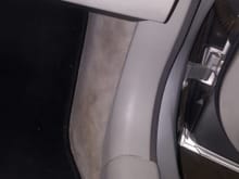 Before you take this side carpet / door trim piece off you need to remove the black tray under the glove box.