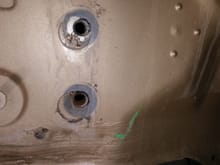 I opened up both the top and bottom holes.  The bottom hole had some rust in it.  I ran a bolt in and out a few times to clean it up. (with some oil)