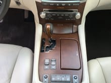 Front center console. Has ride comfort controls, sunshade buttons as well as weather control switch.