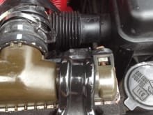 Step 4: Apply lubricant to bolts and remove the 10 mm and 12 mm bolts. Dissconnect air box or intake from throttle  body. Clean the throttle  body with a little carb cleaner while you are there. Do not spray to much only on rag or will flood engine. dissconnect plugs for fan.