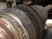 Dented shield and worn teeth on the old ABS tone ring. This was on the old axle.