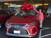 My charming wife, happy with her 2021 RX350 Matador Red Mica!
