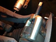 Tie Rod end separator. Note the loosened nut is still on. (picture is upside down)