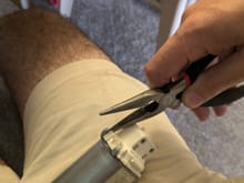 The hard part: there are three very tough metal prongs that hold the motor together. The one on the side by itself is extra nasty. Find a way to bend them until you can liberate the white bearing cap thing. Needlenose in your dominant hand, secure the motor to your genitals with the non-dominant hand and pry.