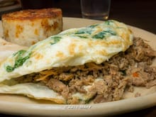 Egg white onlette with sausage, pulled pork and arugula