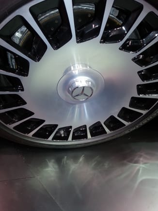 This is an image I captured of Mercedes Maybach rim at Chicago Auto Show..More of a polished surface, but Mercedes did mirror polished finish which I feel is a deficiency... This image presents slots that are smooth finished and painted black.I was conidering this black finish with OEM Lexus rims in the visible  slot area to provide more of a refined look...or...paint the slot arear as car color...Another suggestion was to polish the OEM rims mirror finish and mix a small amount of paint to tint