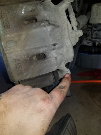 Remove the brakes.  Undo these 2 bolts, there is 1 at the top and 1 at the bottom of the caliper.  Don't worry, you do not have to disconnect brake lines so you will not have to bleed the brakes.  If your brake pads and/or rotors need changed, now's the time.