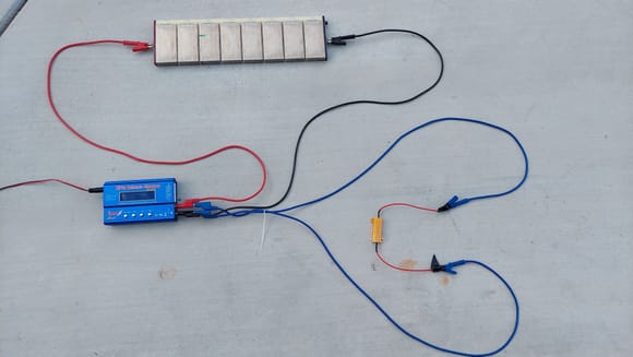 You cannot charge these modules as pictured. 
 They MUST be clamped tightly in a pack.    This is just a demo pic of how the circuit looks. This is during discharge Resistor is plugged in ( blue wire).  This is what's going on with the chargers on the glass table.  