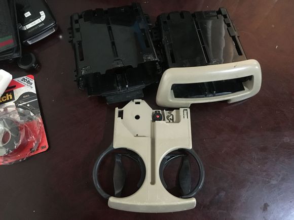 Cup holder works,but does not spring out of cup holder frame. Recommend gluing a pull out tab.