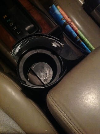 Here's my duct-taped and sides-cut-out 3" pipe adapter working as a Lexus cup-holder fix.  From flimsy and low to stable and functional!