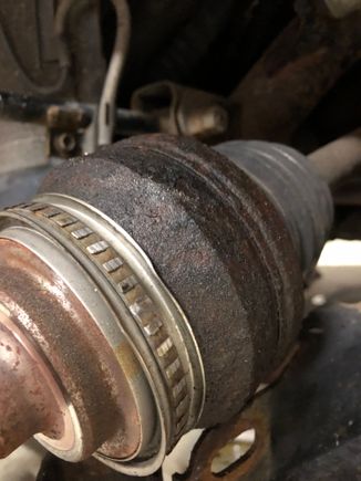 Dented shield and worn teeth on the old ABS tone ring. This was on the old axle.