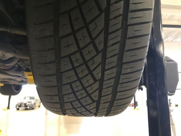 .....and while I was under the car, this is one of my only gripes about our cars. The inner wear pattern of our front tires, because I was told the camber adjusts in and out of turns. "If you drive in a straight line, you'd see even wear on the fronts as well!" (He told me sarcastically.)