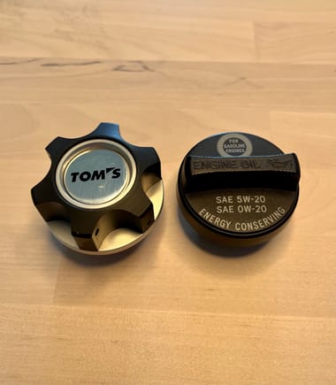 Metal TOMS oil cap. Its an aftermarket tuning company for Toyota like Lorinser for Mercedes or Brabus for BMW. 