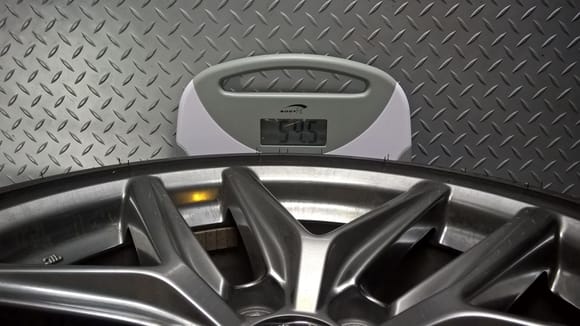 OEM Rear wheel/tire 2.5 lbs HEAVIER than the new larger wheel tire combo.