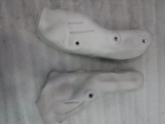 Exhaust manifold heat shields after bead blasting by Jet-Hot.
