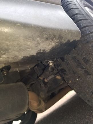 10 mm screw connecting mud flap to bumper.