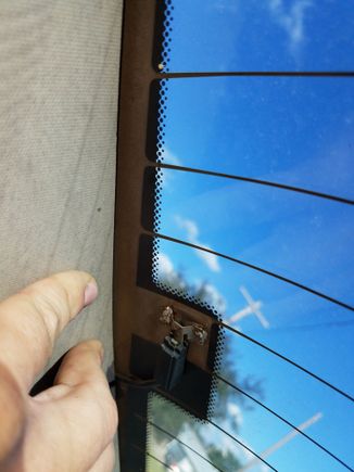 Defroster has a connection like this on each side.  Looks like all the strands run parallel from one side to the other.