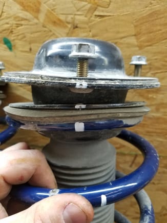 Here you can see the center punch marks for aligning the spring cup with the strut top. The thought is this will allow me to properly align this part during reassembly.
