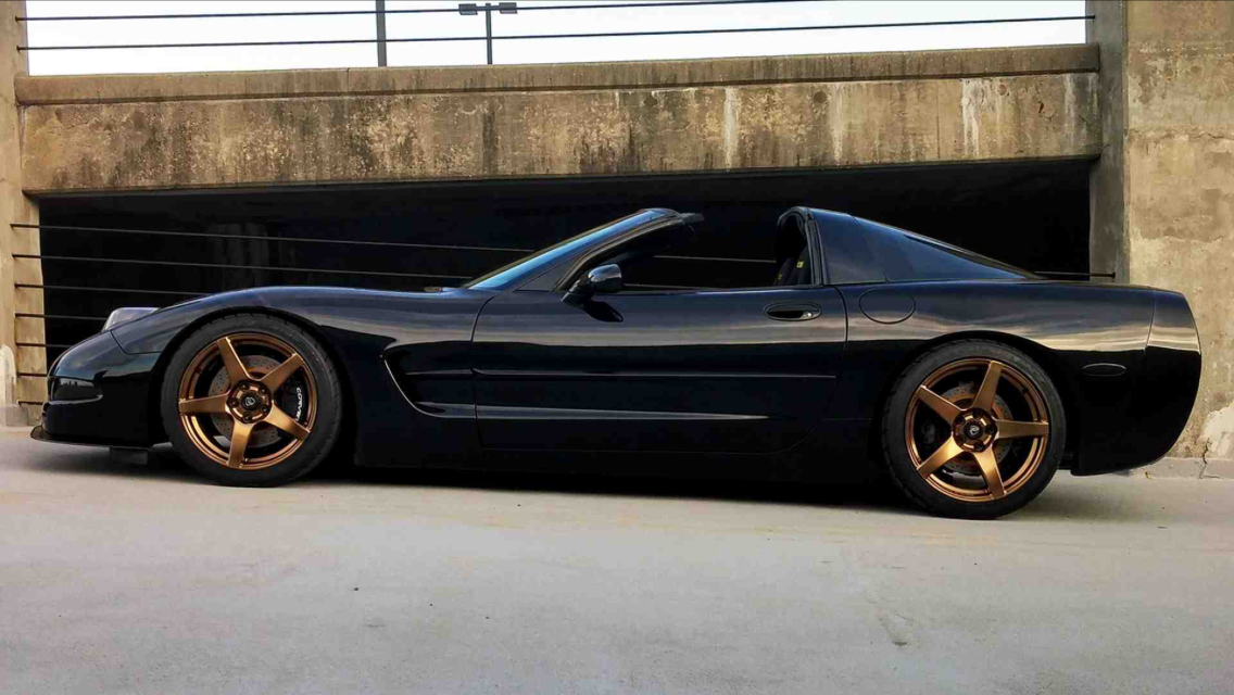 black car gold wheels