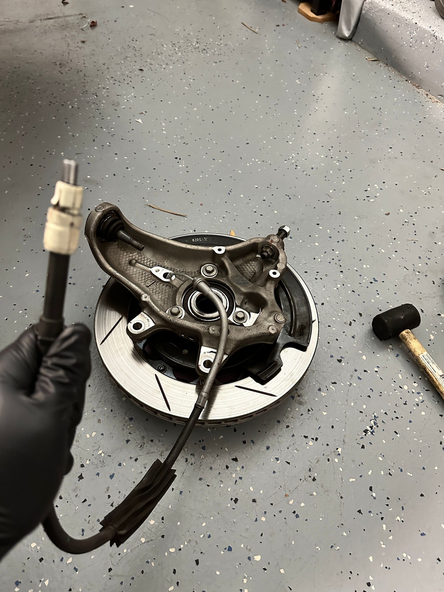 How to remove a freely spinning but laterally stuck rear brake rotor