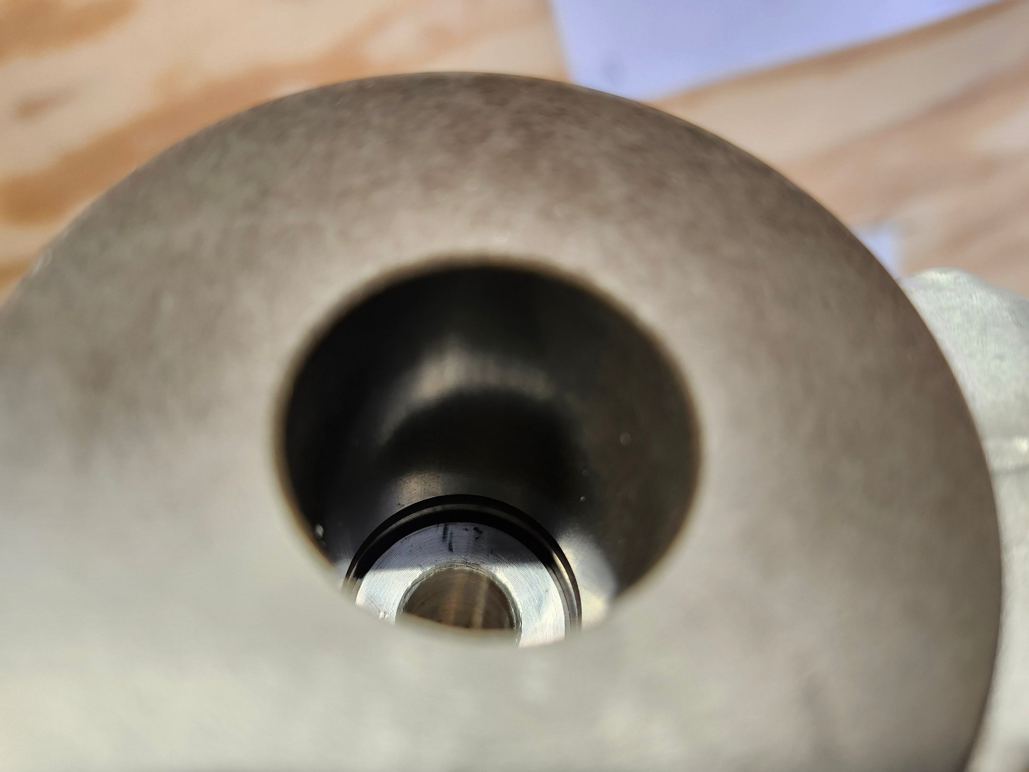 Long bushing with narrow flange - rear lwr mount outer.