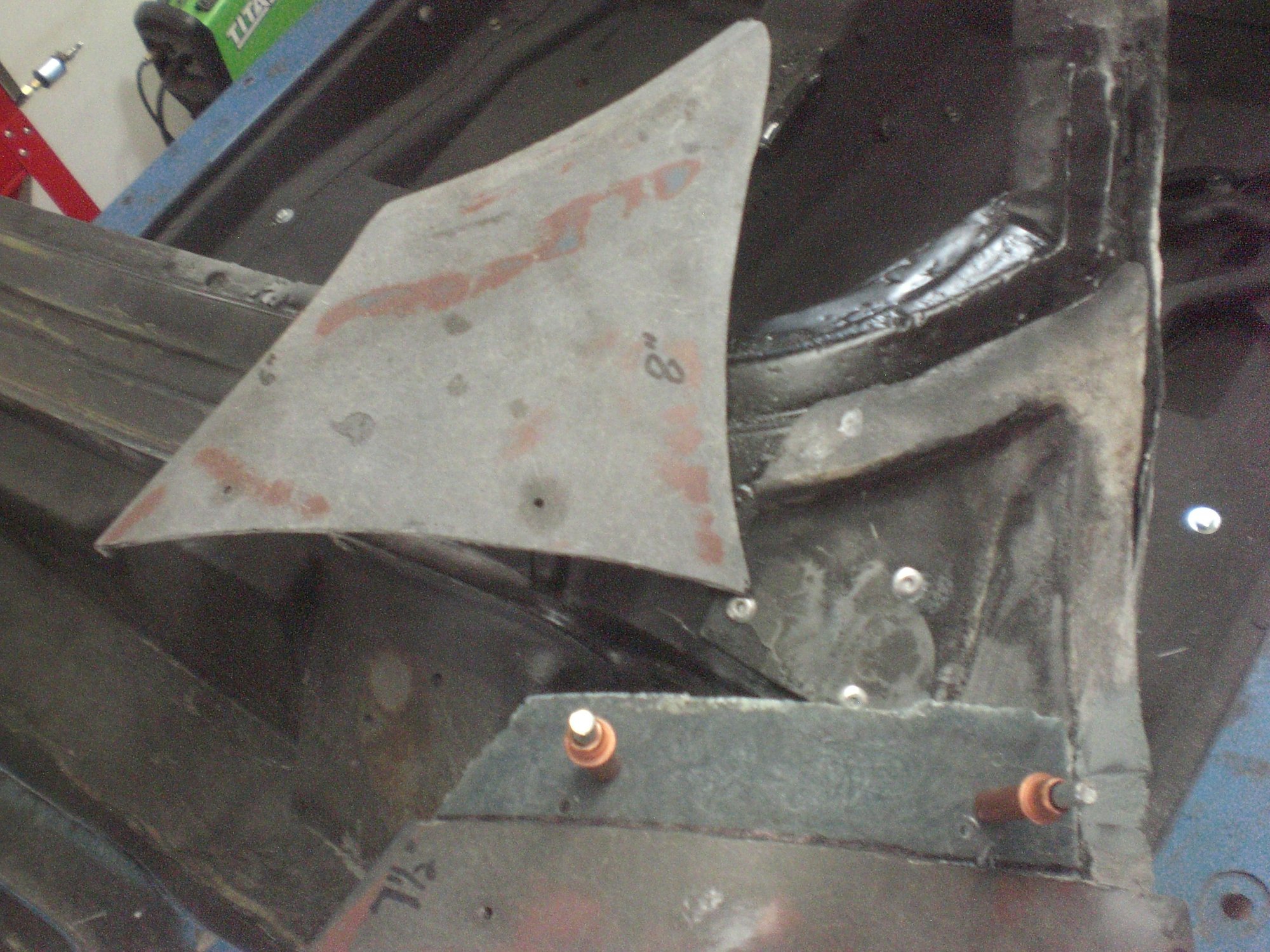 Once that adhesive set up, the cut fender tip was ready to be glued back into place.  Adhesive would be applied to the fabricated bonding strip and the #7 shaped bonding flange of the support structure.