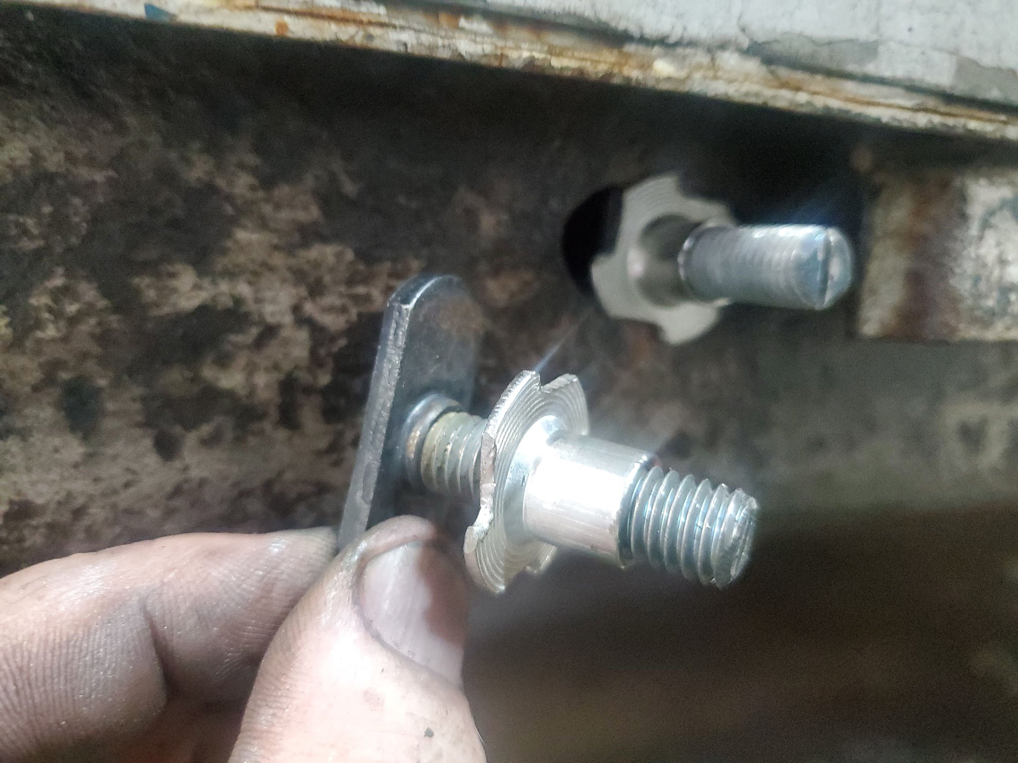 Side pipe frame bolts and tee nuts. 