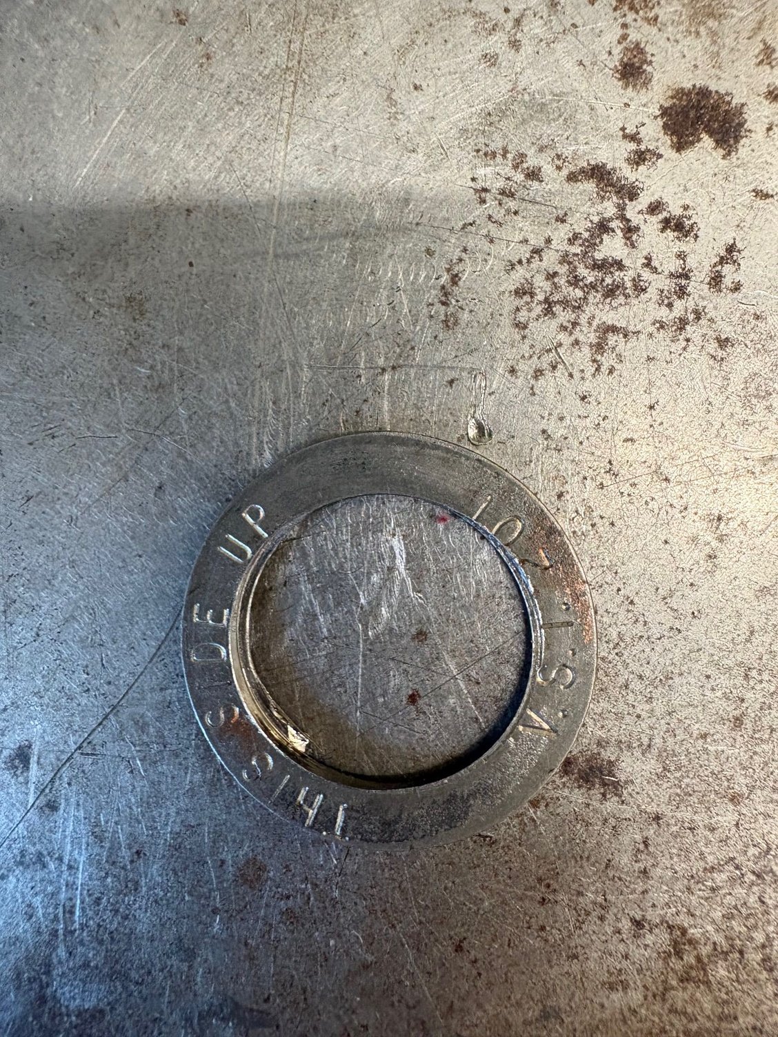 Spacer under spring appears to have damage from the damper.