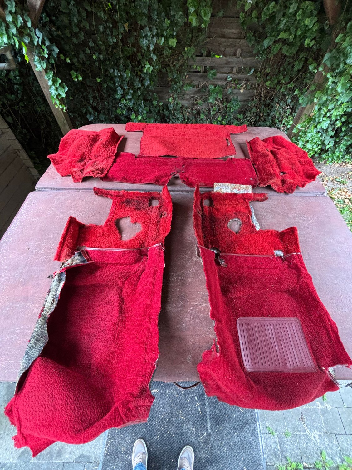 Old carpet with holes and a smell.