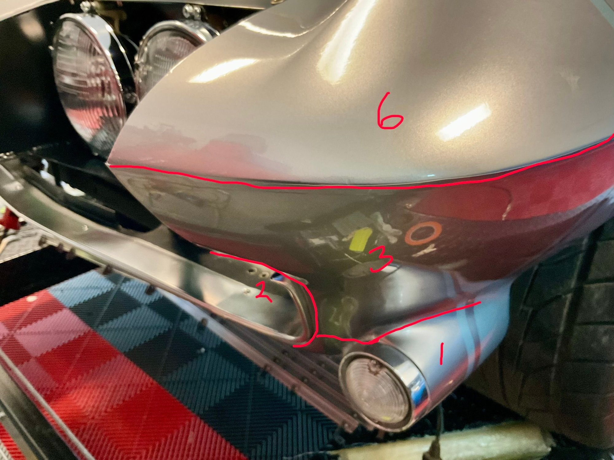 The upper valance #2 is next. Overlap #1 and wrap it inside the nose opening all the way up to the headlight opening. #3 is next and #4 is the same piece on the other side. Where it meets pieces #1 and #2 is a difficult seam, but you will get it with a little practice.
