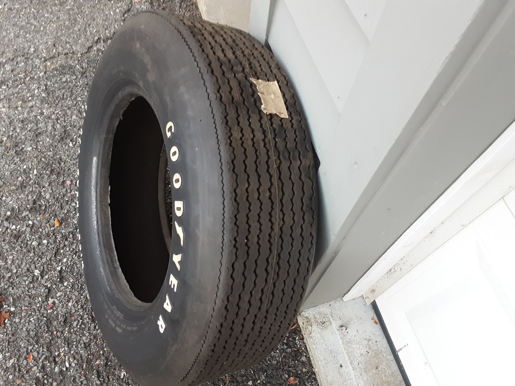 Portioin of the original tag stapled to the tread surface