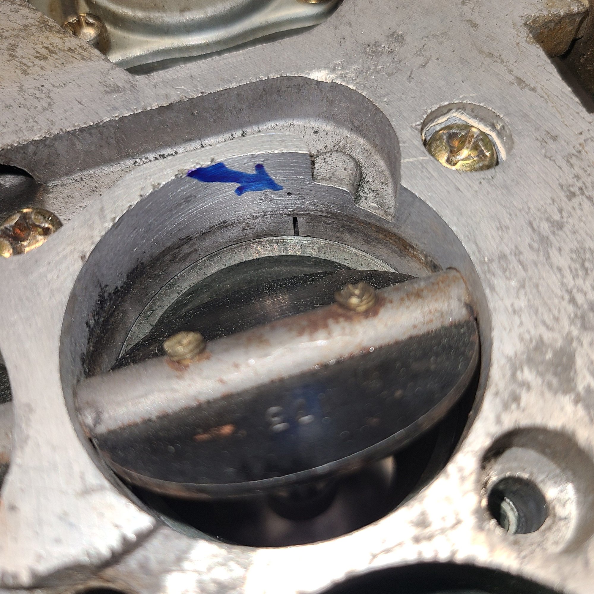 Secondary butterflies open to show the secondary transfer slot. On a 2 idle circuit carb such as this,  the secondary transfer slot is not exposed at idle.  If you can see it, you have the secodary throttle stop screw way out of adjustment and the car will idle very high and/or badly.
