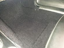 Passenger side footwell new carpet
