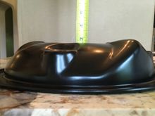 It’s actually just less than 2” as the mounting flange is below the high point shown by the tape measure.