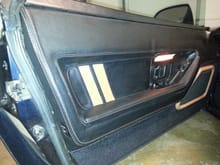 Leather wrapped door panels, custom speaker housing with matching speaker frame, custom formed speaker grills.