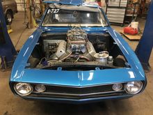 This is the car. I did all the fabrication including building the hedders and exhaust + chassis and roll cage which is certified to 8.50
The body and doors are steel, the front clip is bolt together fiberglass to give it more of a stock look 