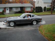 Restored 1972 Datsun 240Z begin delivered to my house.  It had a $20K restoration done in Georgia and the owner had to sell it a a great loss.  Nice classic car.