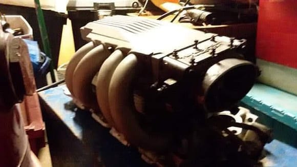Looks like the original intake is sitting on the bench.