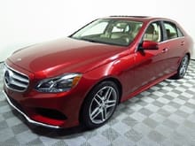 The daily driver: a 2014 E350 4matic in a slightly more orange Cardinal Red.