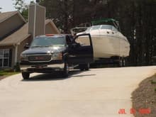 This is the main reason for the truck. I do drive the boat off the trailer and I put it back on the trailer and I am awesome at doing right the 1st time. I can back up to a dock also, so that people just hop on the platform on the back of the boat. It's a 27ft Monterey Cruiser. We live on this boat all weekend. has beds and a kitchen, and a shower,toliet. It's our life.