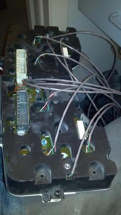 The back of the original gage cluster "mother board" with a custom harness going to a "dummy" cluster in the chevy bezel.